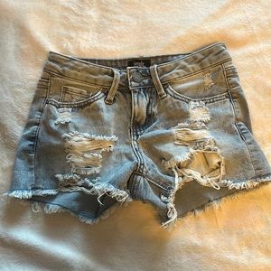 Blue ripped denim shorts